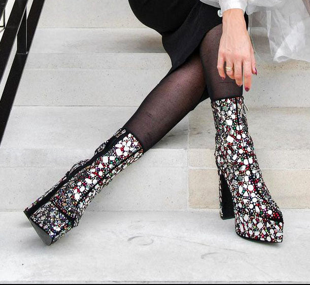 Woman wearing London Rag Mirror Embellished Platform High Heel Ankle Boots with rhinestones, sitting on stairs